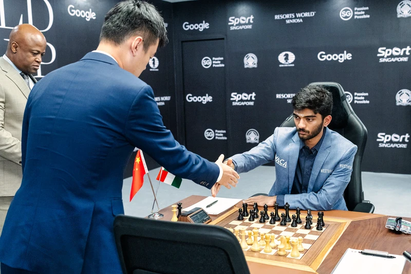 Ding Liren's handshake arriving at the board. Photo: Maria Emelianova / Chess.com