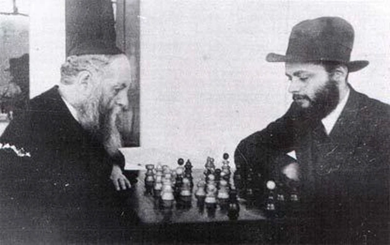 7th Lubavitcher Rebbe plays chess with his Father in Law 6th Lubavitcher Rebbe