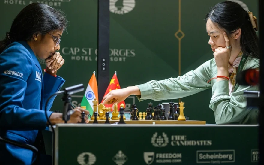 GM Vaishali Rameshbabu at the press conference after her win against GM Kateryna
Save into
Candidates Round 13: Sindarov is the 2026 World Championship Challenger
![GM Javokhir Sindarov shakes GM Anish Giri's hand after finishing their
Save into
Candidates Round 12: Sindarov One Draw Away, Vaishali and Zhu in Joint First
![GM Vaishali Rameshbabu vs. GM Zhu Jiner