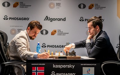 Grandmaster Ian Nepomniachtchi plays a move during the game with World Champion Magnus Carlsen