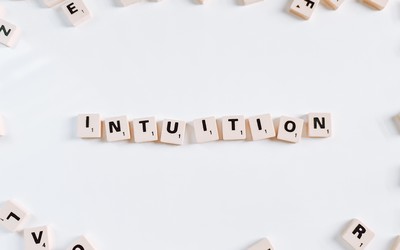 "Intuition" spelled out with scrabble tiles