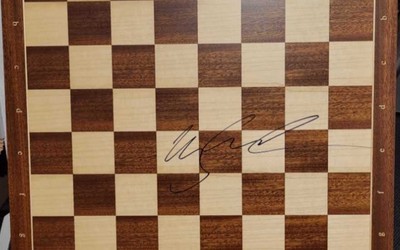 Chessboard signed by Magnus Carlsen