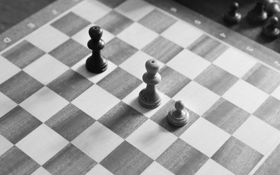 A chess board with a white pawn on e3, white king on e4, black king on e6.