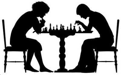 Two people playing chess in person