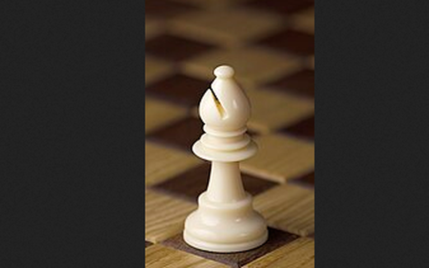 White bishop on a chess board