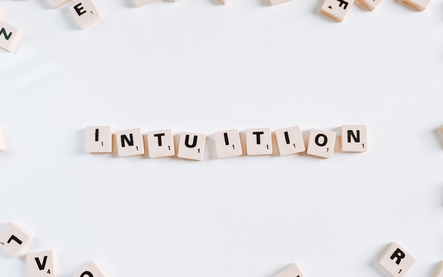 "Intuition" spelled out with scrabble tiles